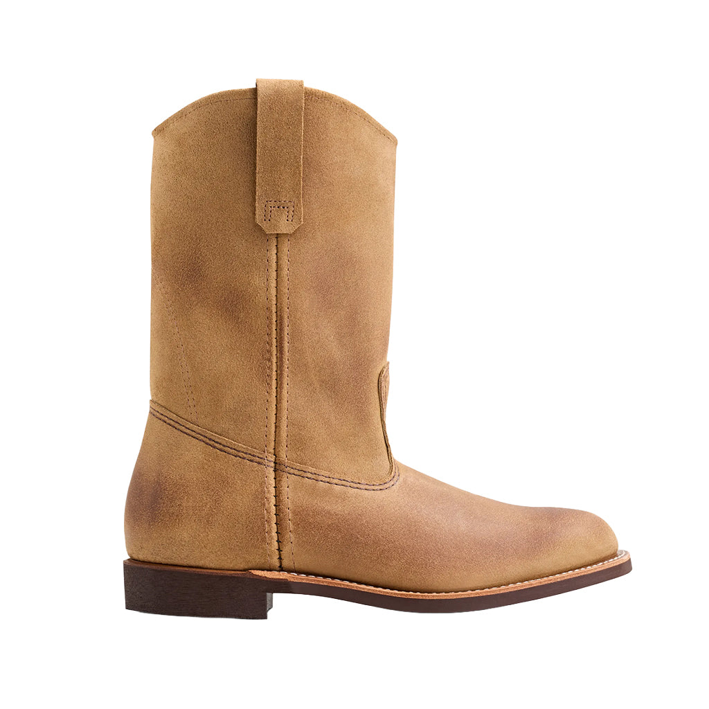 Tan cowboy boot on a white background