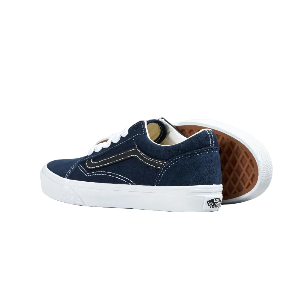 Navy blue sneaker with white sole on a white background