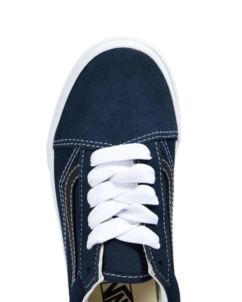 Navy blue sneaker with white laces on a white background