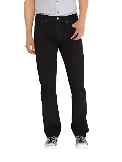 A person standing against a white background, wearing black Levis 501 Original Fit jeans and a white shirt with a collar.