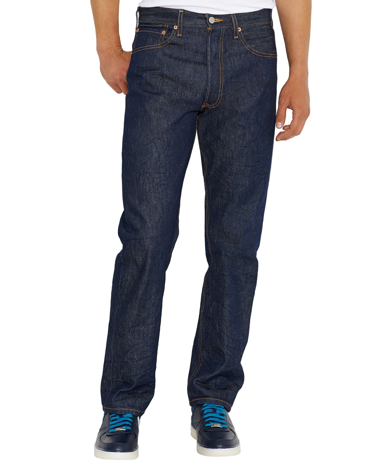 A person standing upright wearing a pair of blue, rigid, straight-fit 501 Original Fit Levi's jeans and blue and white sneakers.