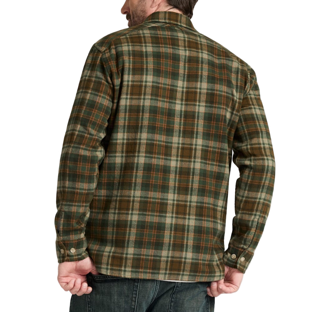Man wearing a green plaid shirt on a white background