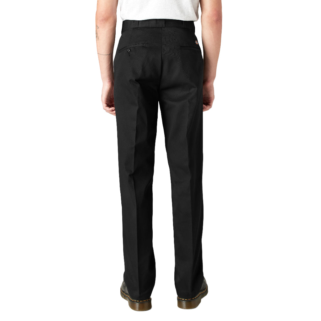 Person wearing black pants on a white background
