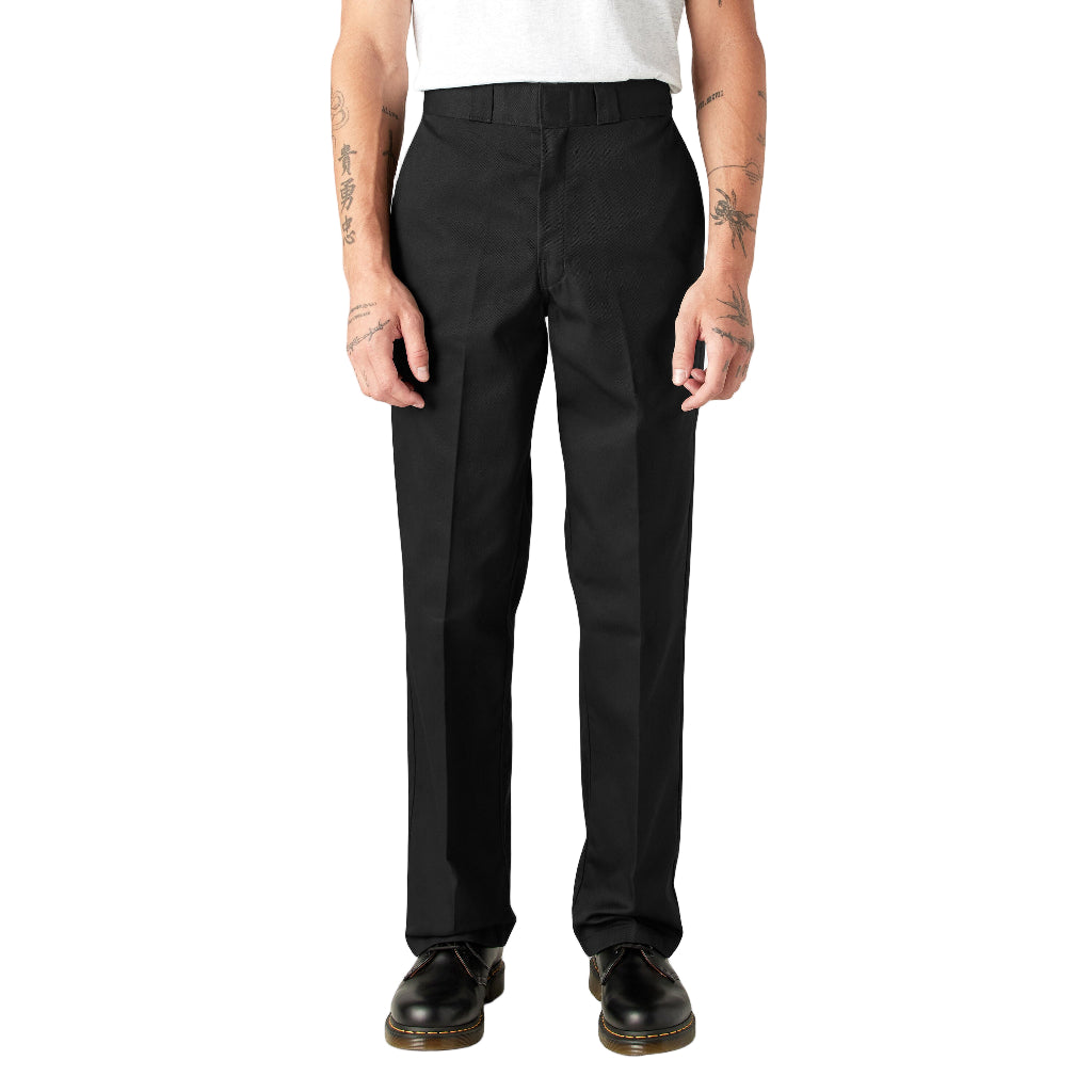 Person wearing black pants on a white background
