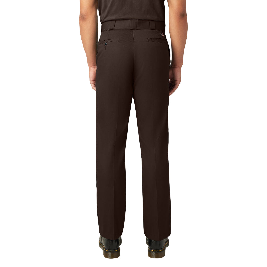 Dark brown pants worn by a person on a white background