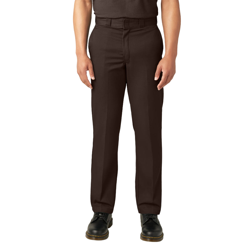 Brown pants worn by a person on a white background