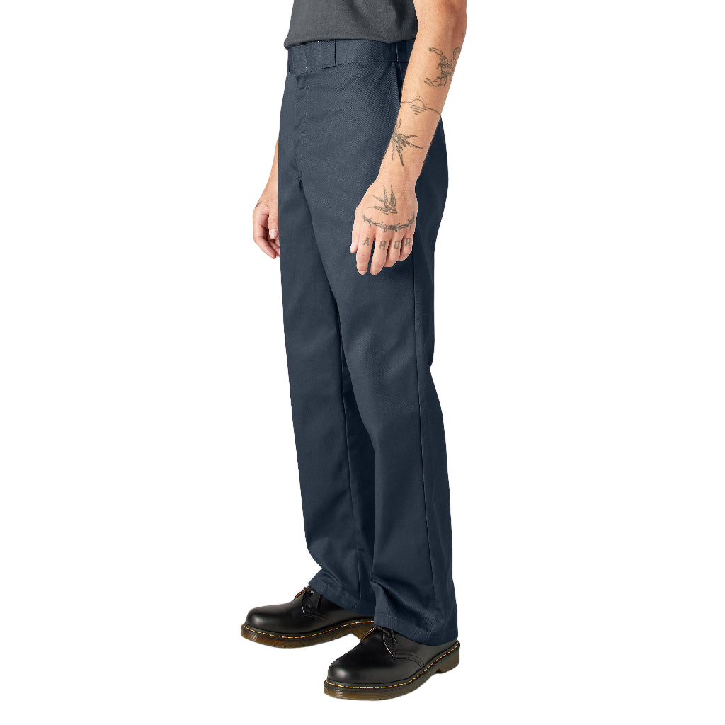 Person wearing navy pants on a white background
