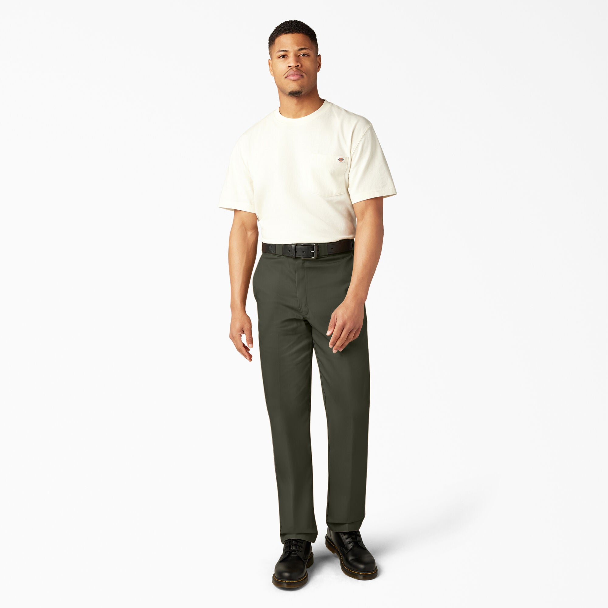 Man wearing a white t-shirt and green pants on a white background