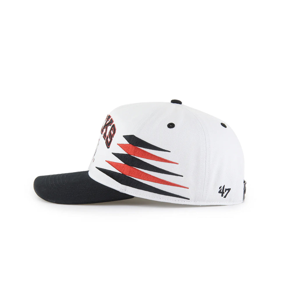 Black and white cap with red and black design on a white background