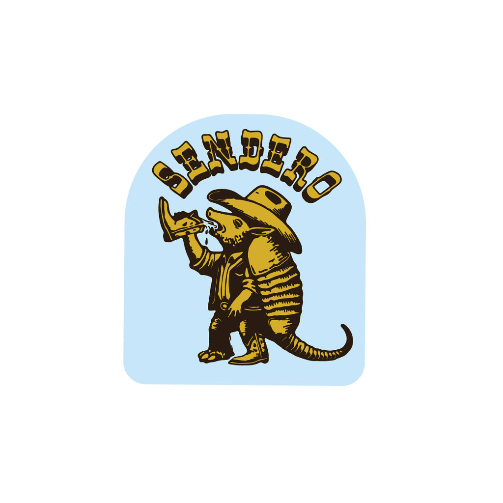 Sendero logo with armadillo wearing a hat and holding a gun on a light blue background