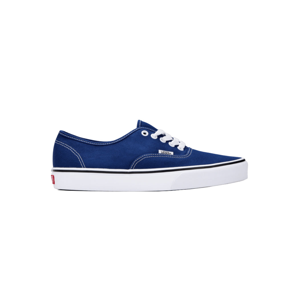 Blue sneaker with white laces on a white background