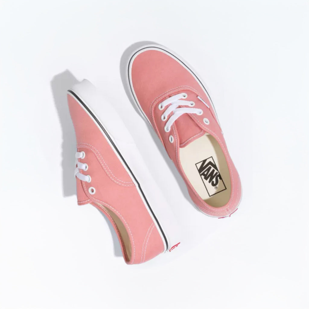 Pink Vans sneakers on a white background