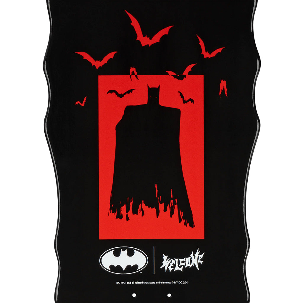 Black tank top with red graphic of a silhouette and bats, featuring Batman logos.