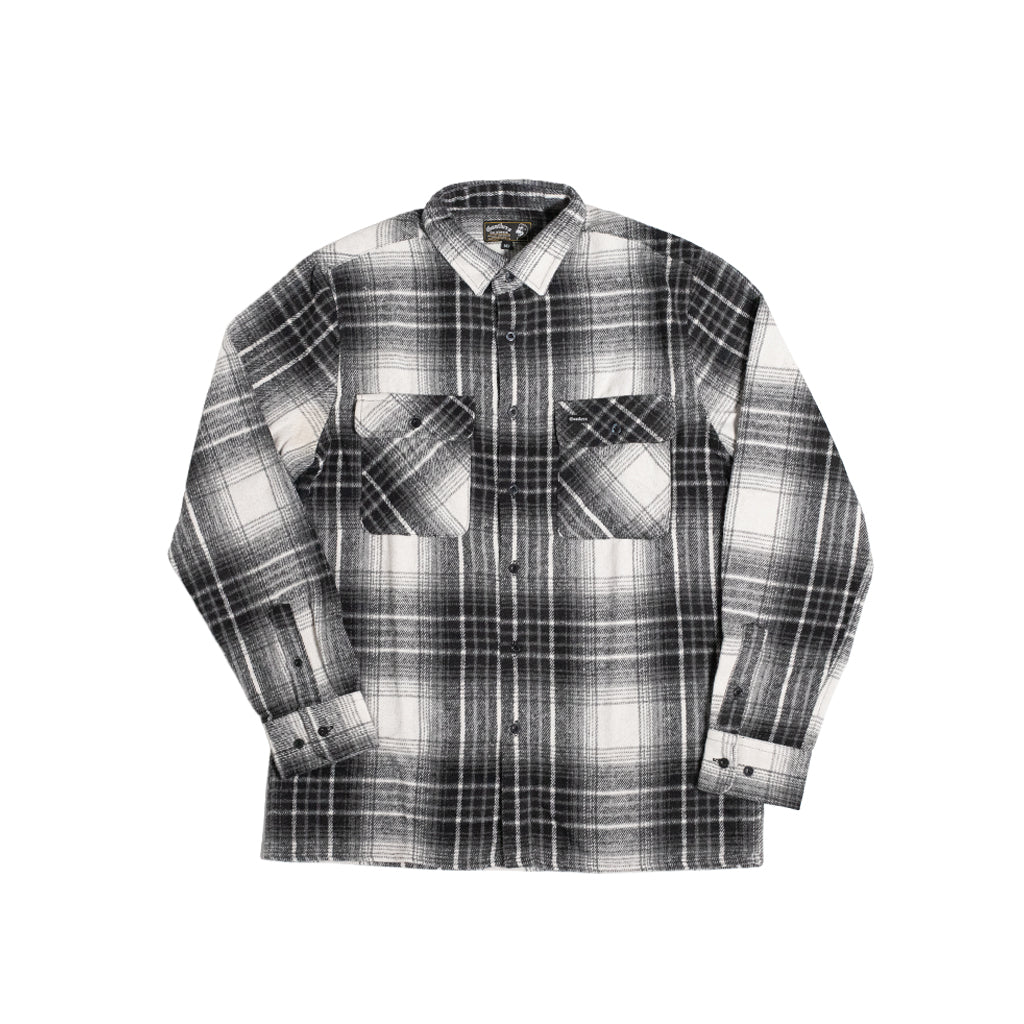 A long-sleeve plaid button-up shirt in black, white, and gray, featuring two large patch pockets on the front, displayed flat against a solid white background.