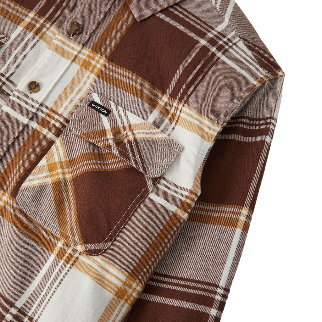 Brown and beige plaid shirt with a brand label on a white background