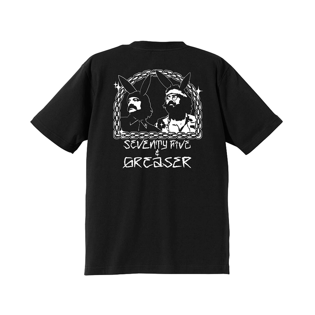 A black short-sleeve t-shirt shown from the back, featuring a white graphic print of two stylized figures inside a circular frame with the text 'SEVENTY FIVE GREASER' below.