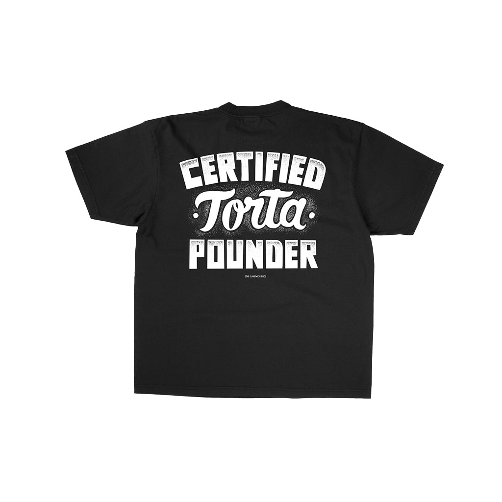 Black t-shirt with certified torta pounder script in white on a white backdrop