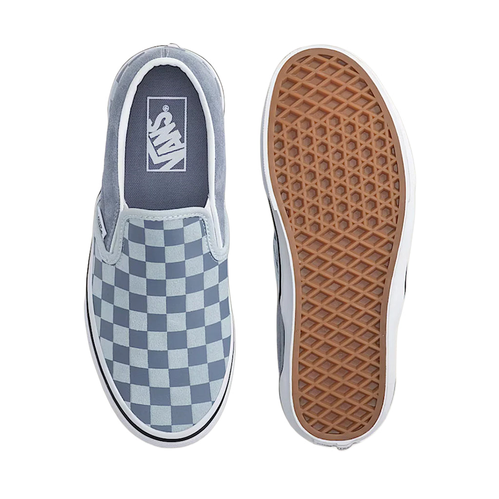 Vans slip-on sneakers with checkered pattern and brown sole on a white background