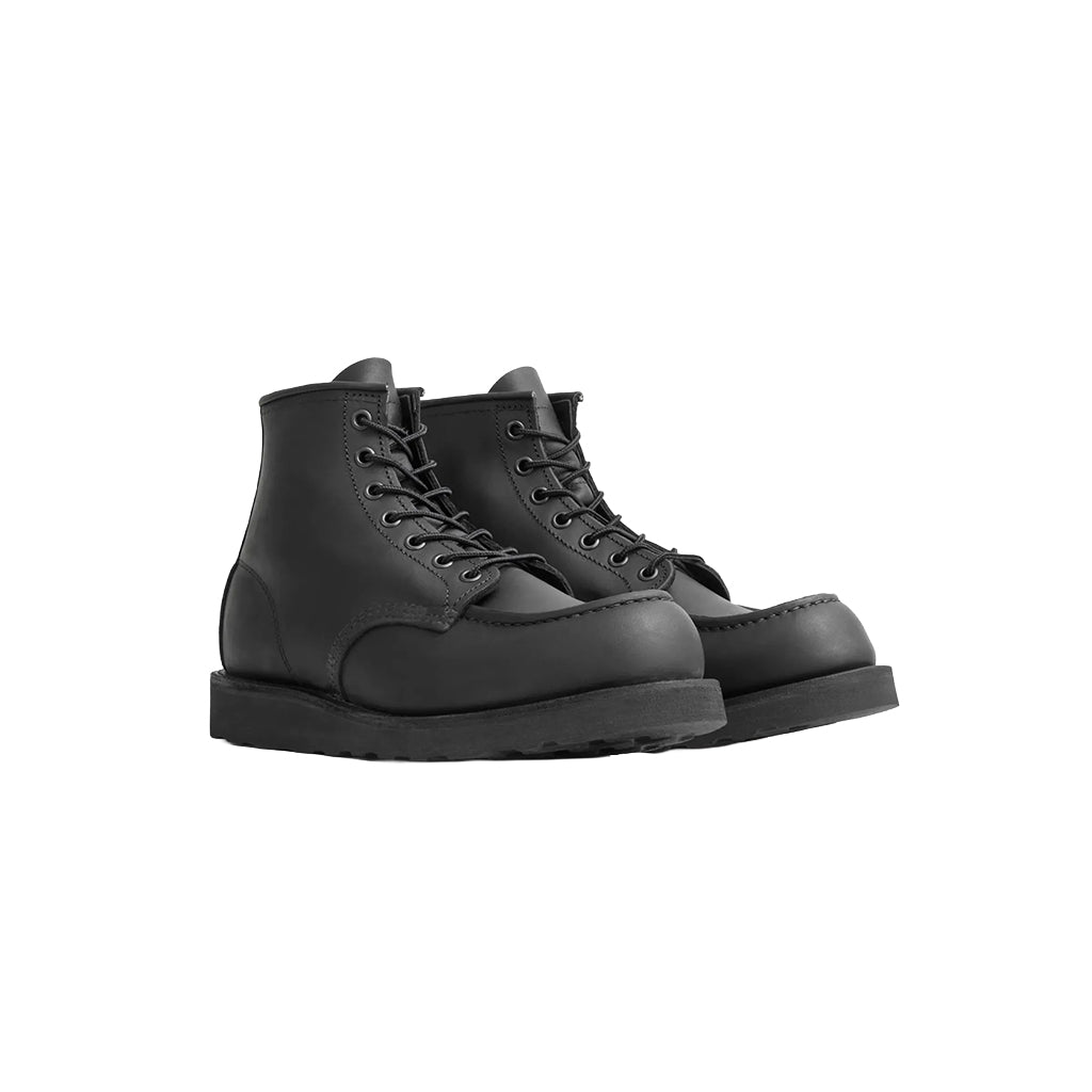 Pair of black leather boots on a white background
