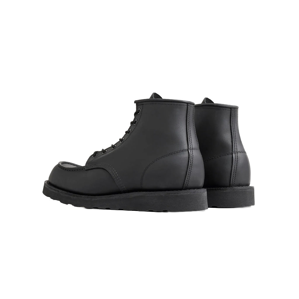 Pair of black leather boots on a white background