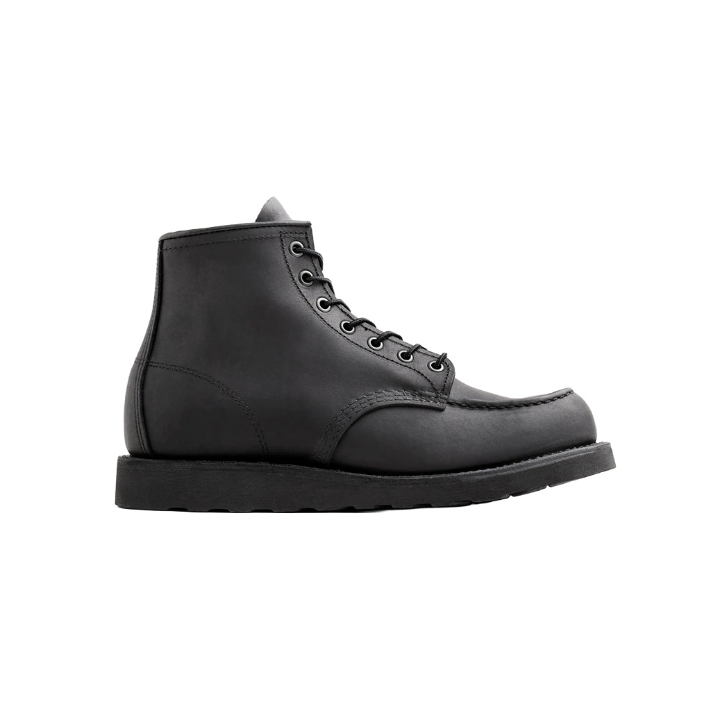 Black leather boot on a white background