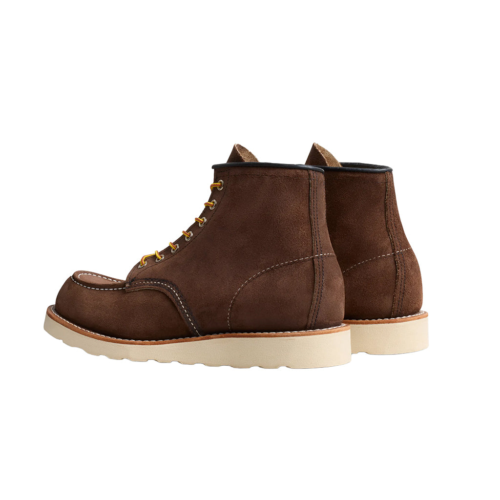 Brown leather boot with white sole on a white background