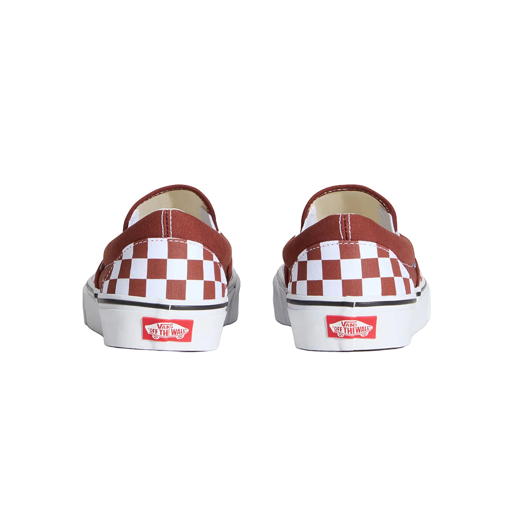 Pair of red and white checkered slip-on shoes on a white background