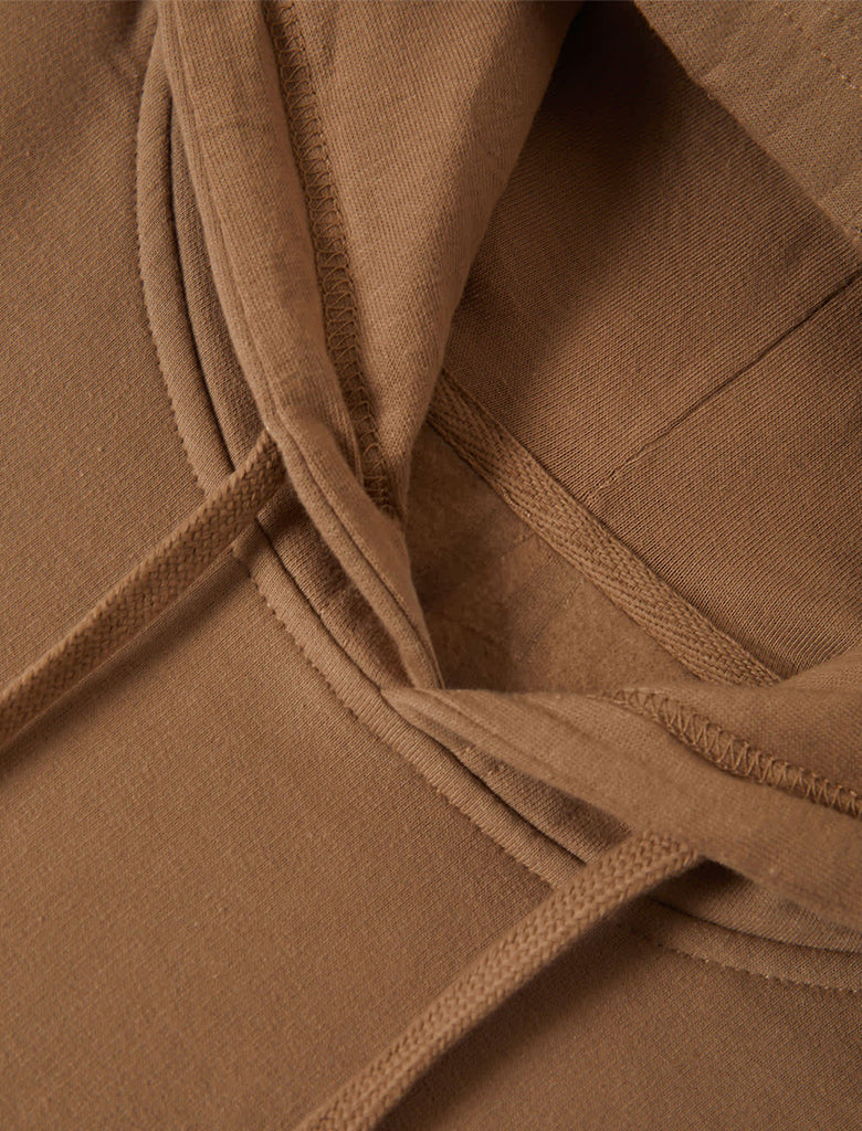 Close-up of brown fabric with folds