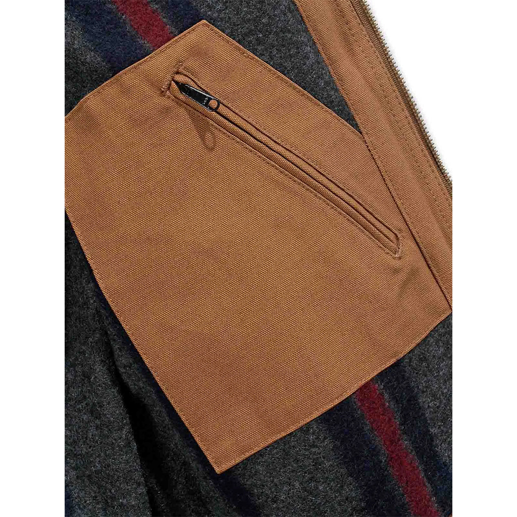 Close-up of a brown pocket on a plaid fabric background