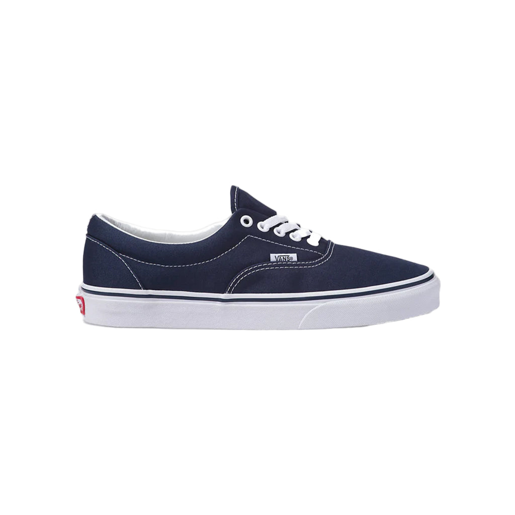 Navy blue sneaker with white laces on a white background