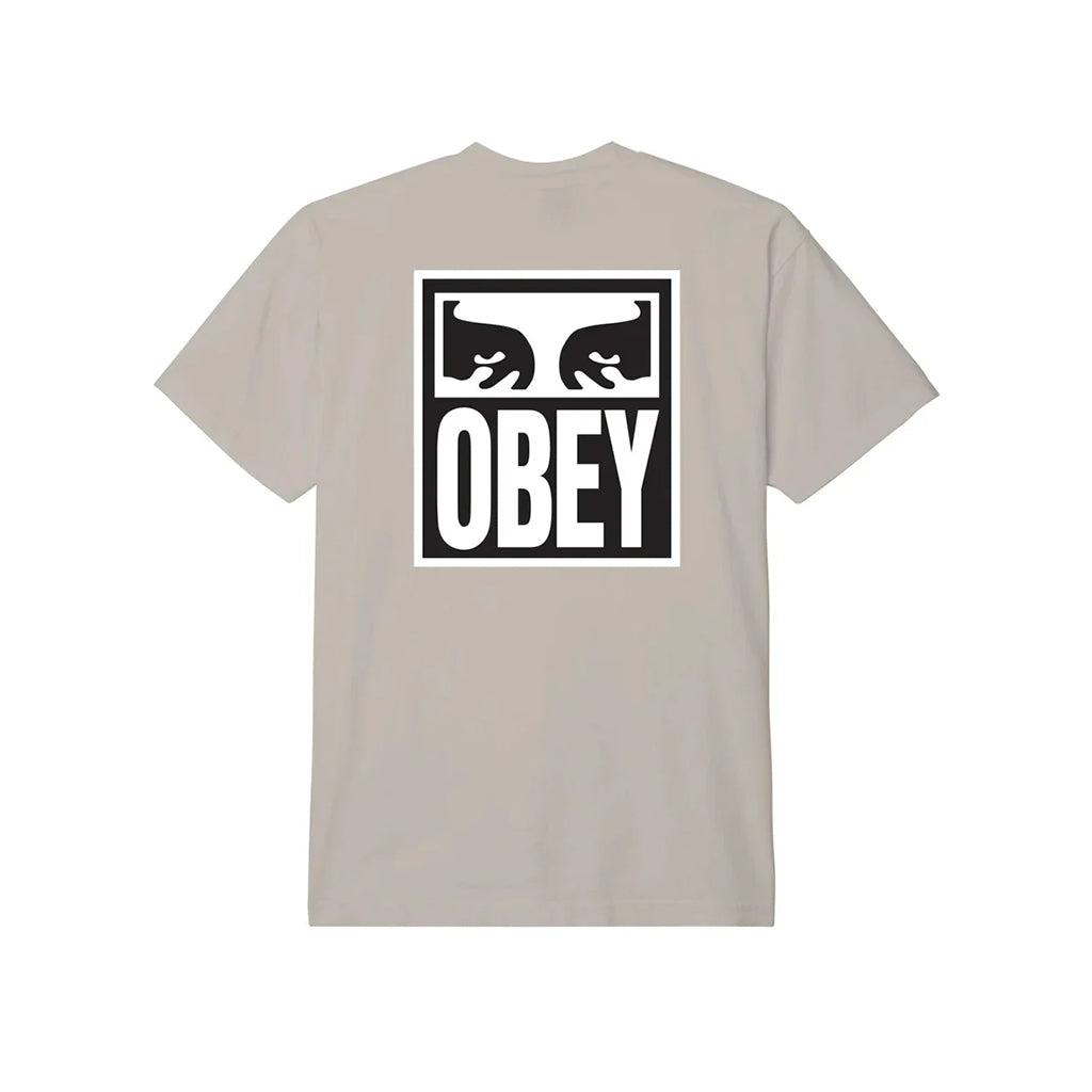 Beige t-shirt with 'Obey' logo on the back against a white background