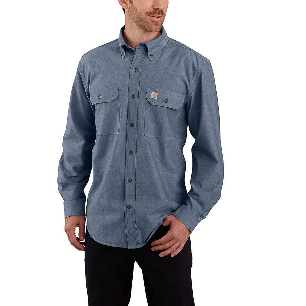 Man wearing a blue button-up shirt with a visible brand logo on a white background