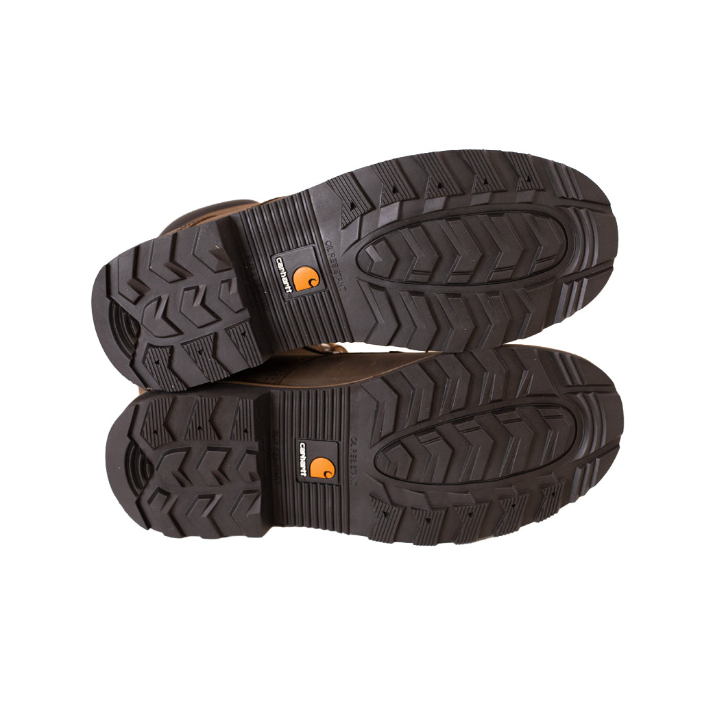 Pair of brown work boots with black soles on a white background