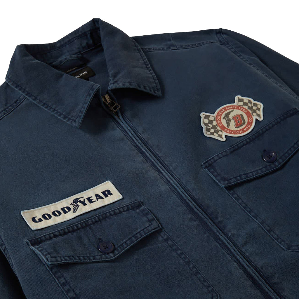 Navy blue jacket with Good Year logo and patch on a white background