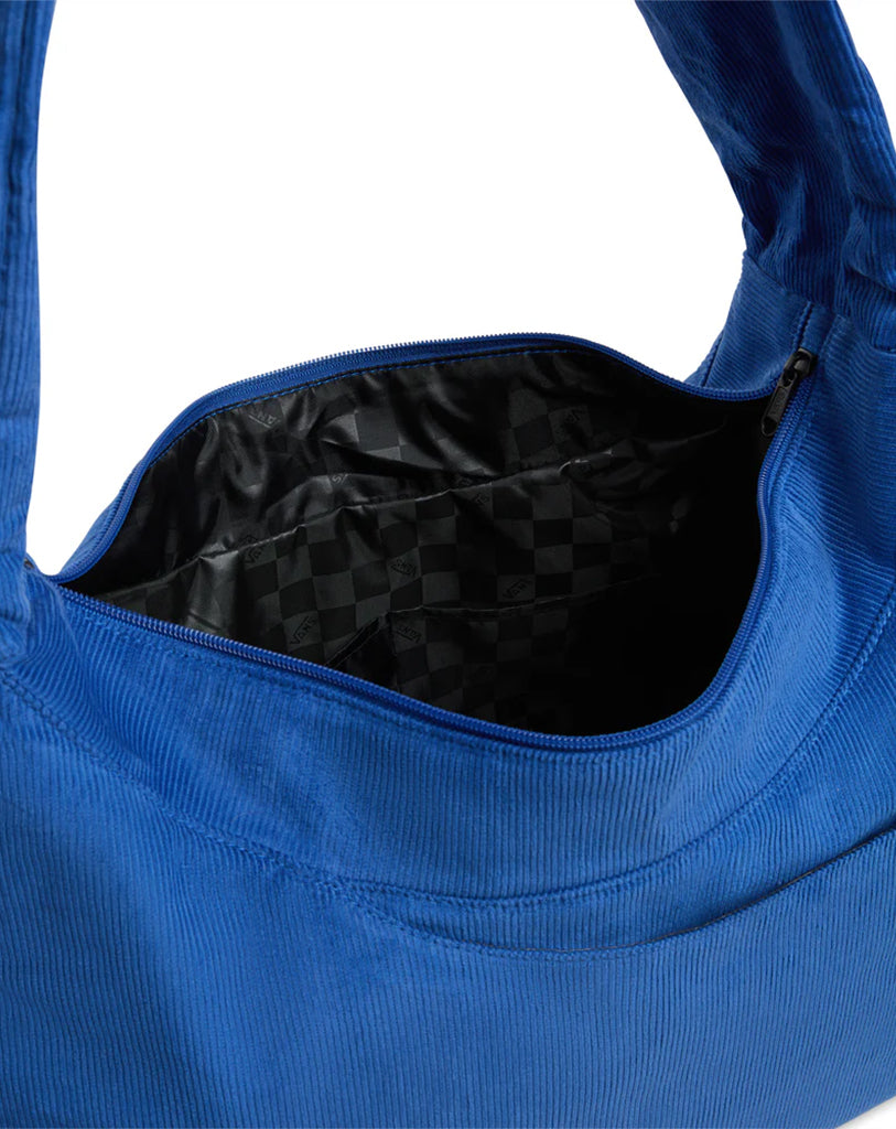 Blue tote bag with black checkered interior on a white background