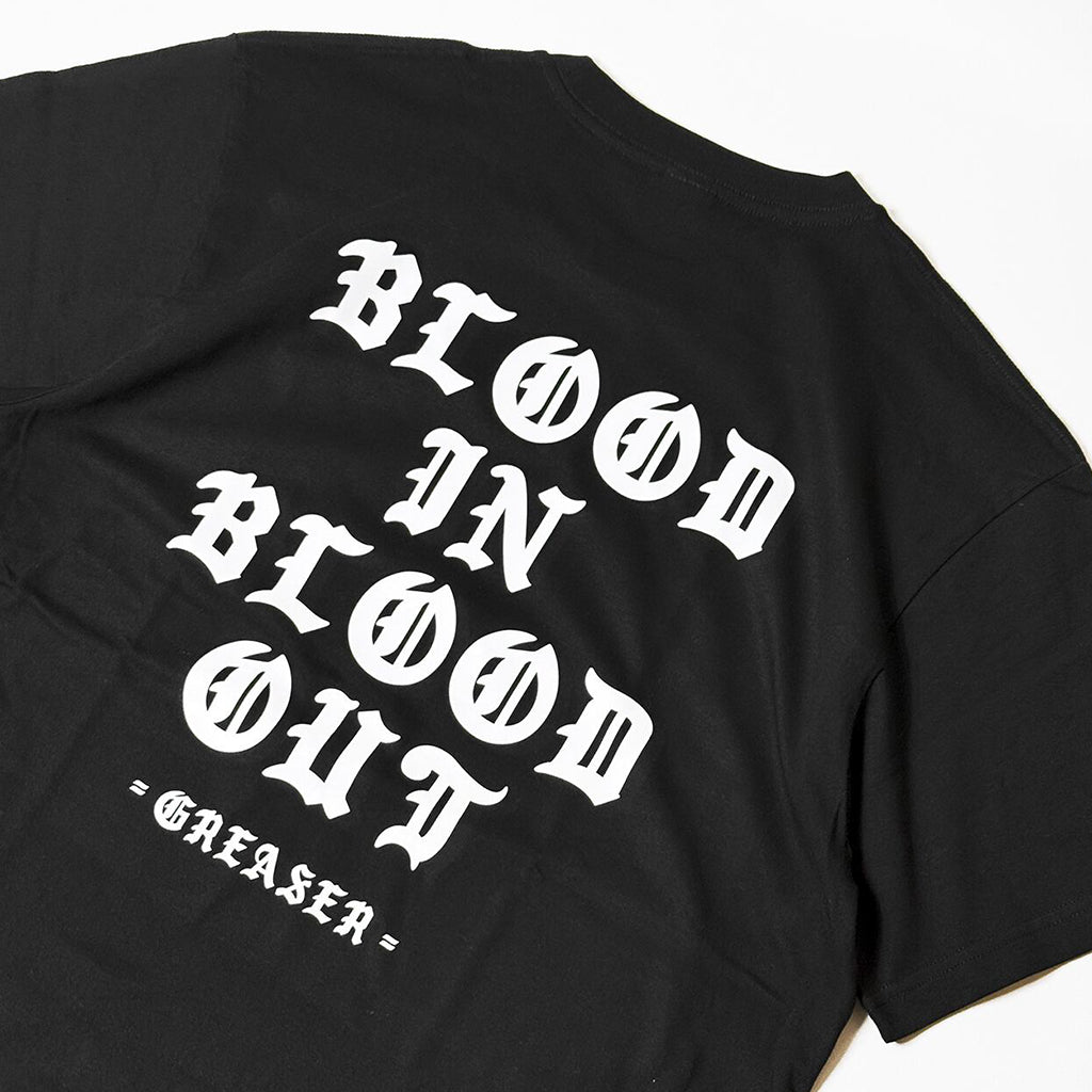 Black t-shirt with white text 'BLOOD IN BLOOD OUT' on a white background