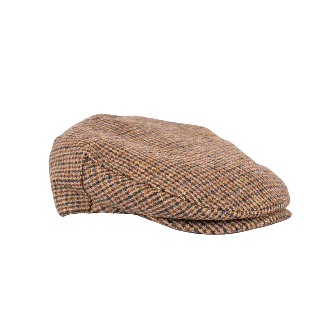 Brown checkered flat cap on a white background