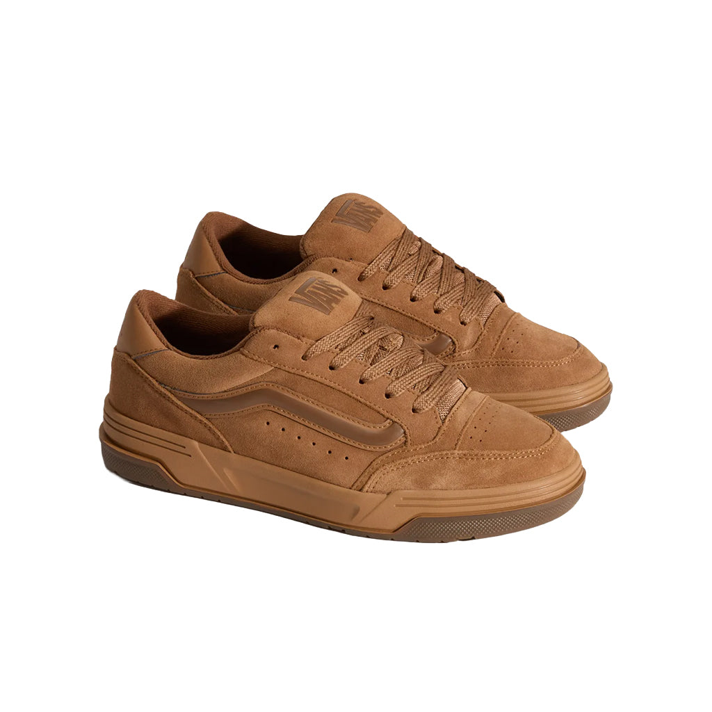 Pair of brown sneakers on a white background