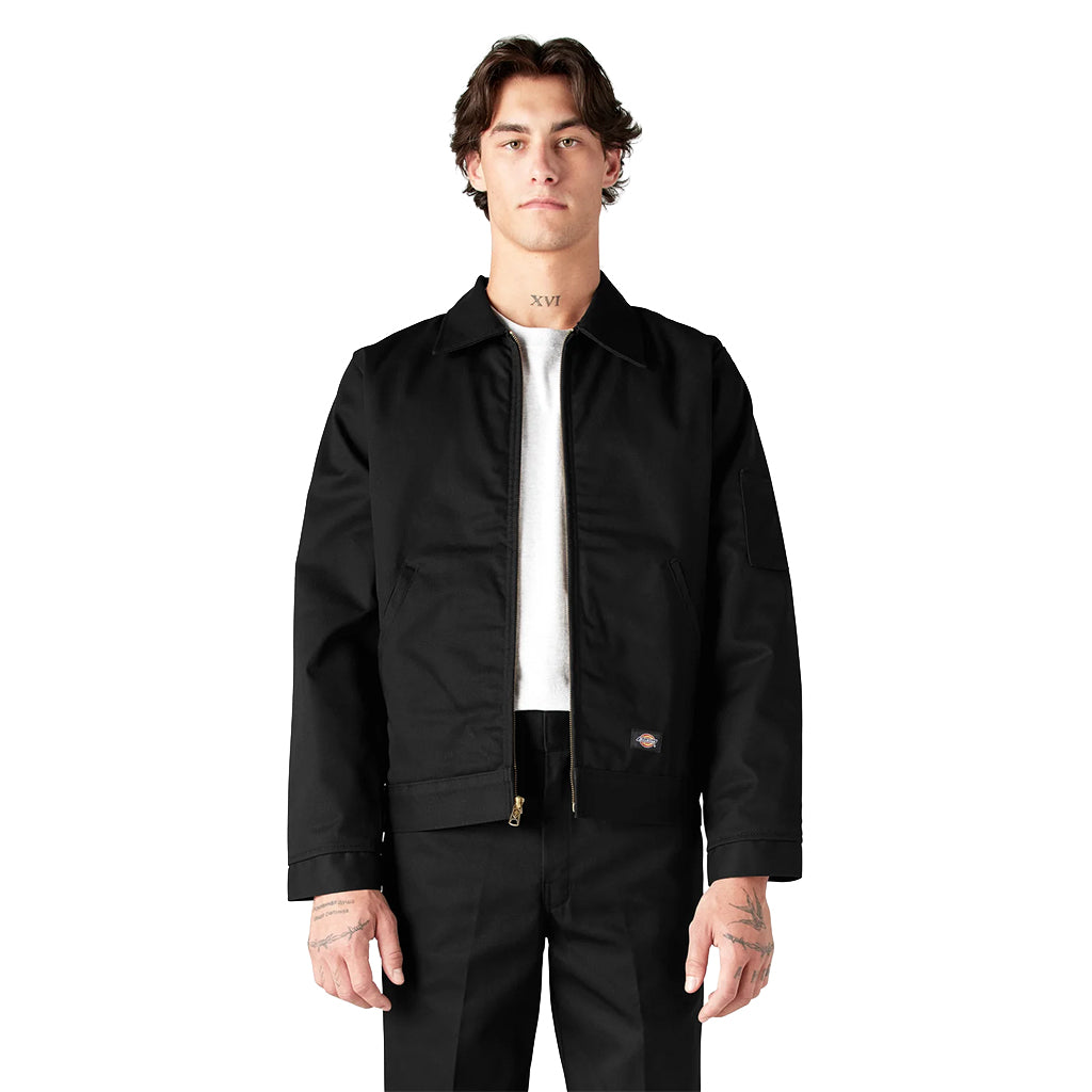 Person wearing a black jacket and pants on a white background