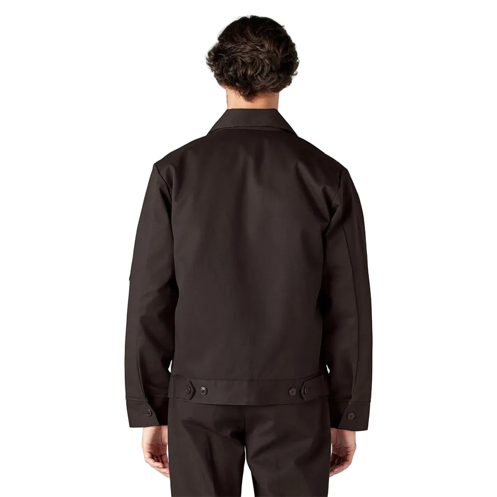 Person wearing a dark brown jacket on a white background