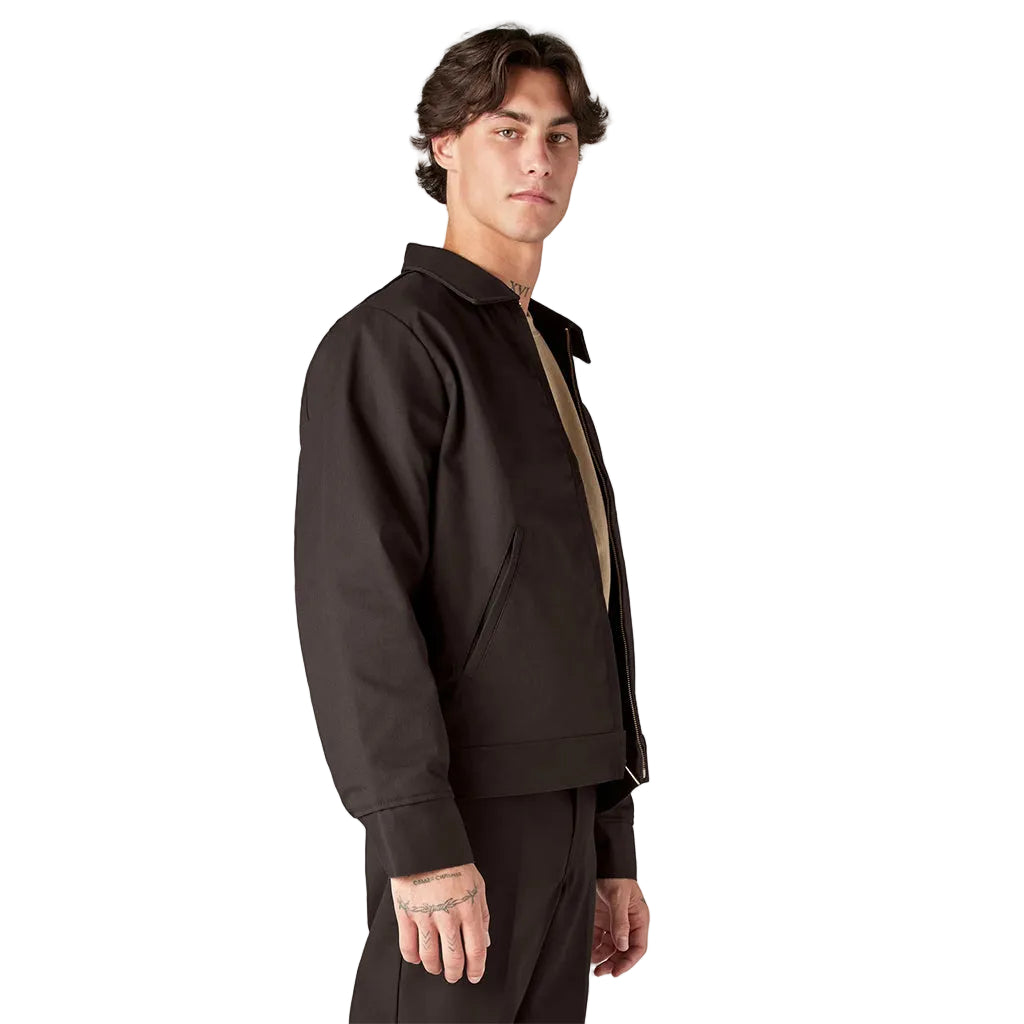 Man wearing a dark brown jacket and pants on a white background