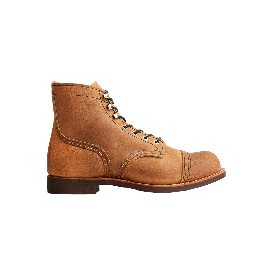 Brown leather boot on a white background