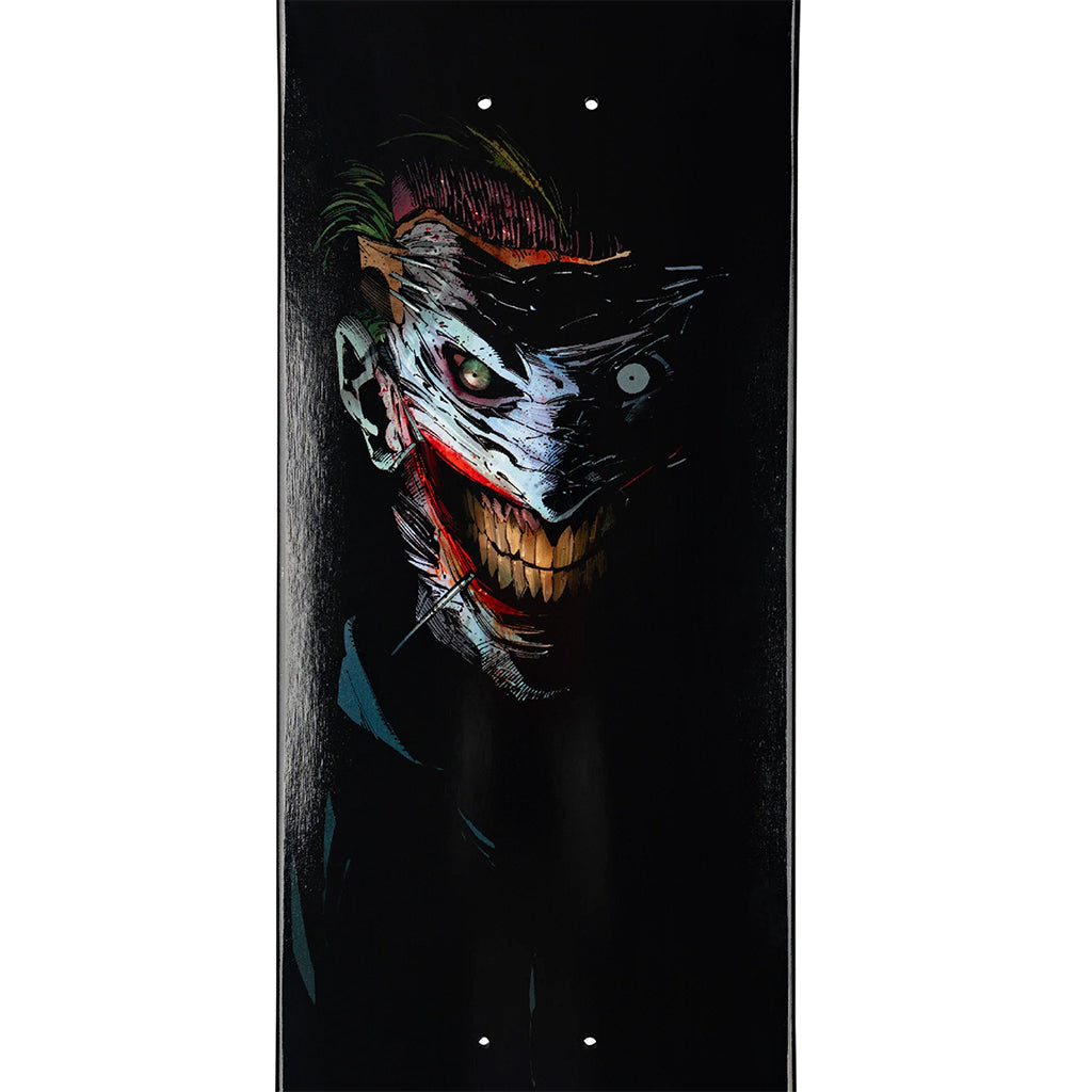Skateboard deck with a graphic design of the joker on a black background