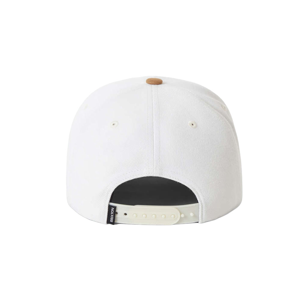 White cap with a black patch on a white background