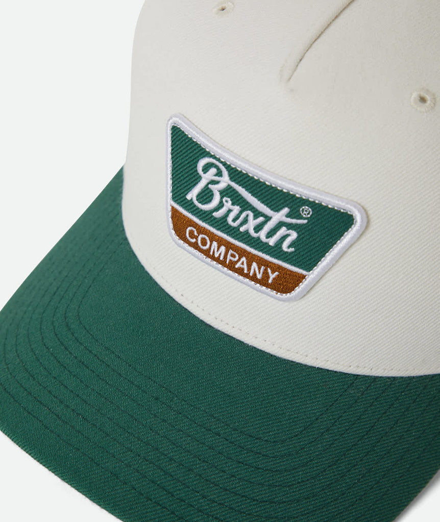 Green and beige cap with Brixton logo on a white background