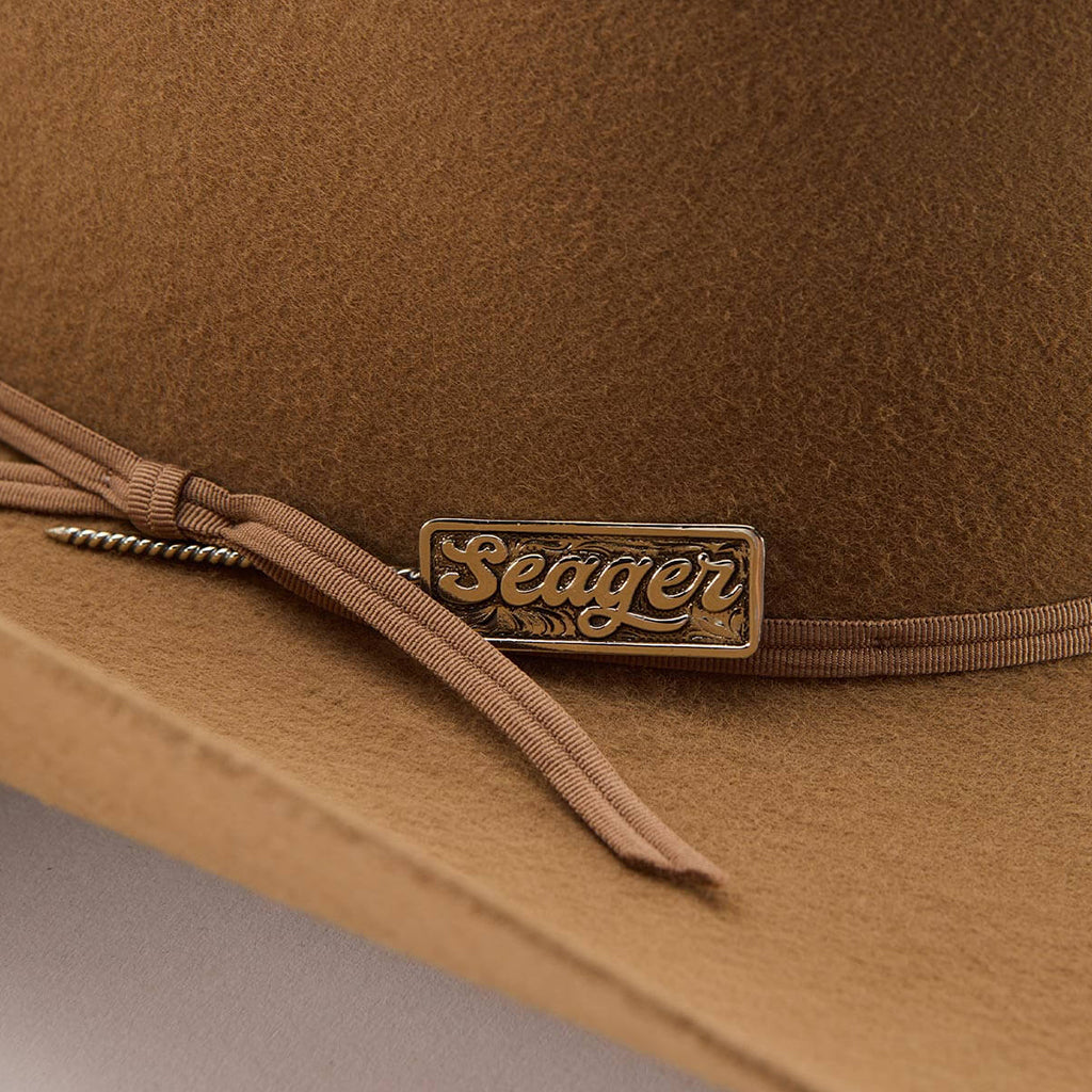 Brown hat with 'Seager' logo on a gray background