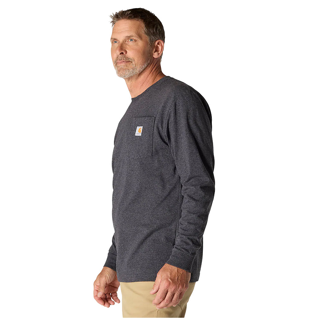 Man wearing a dark gray long-sleeve shirt with a pocket on a white background