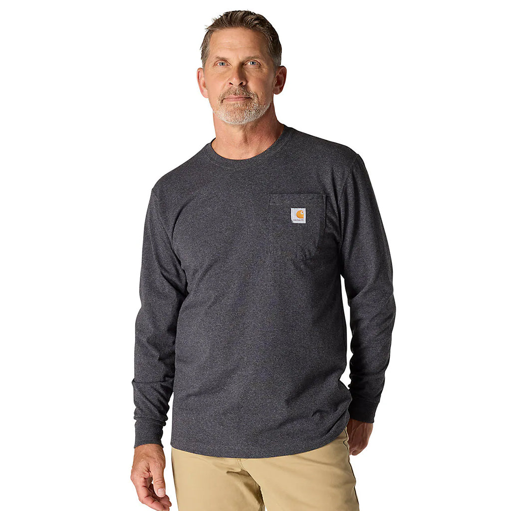 Man wearing a dark gray long-sleeve shirt with a pocket on a white background