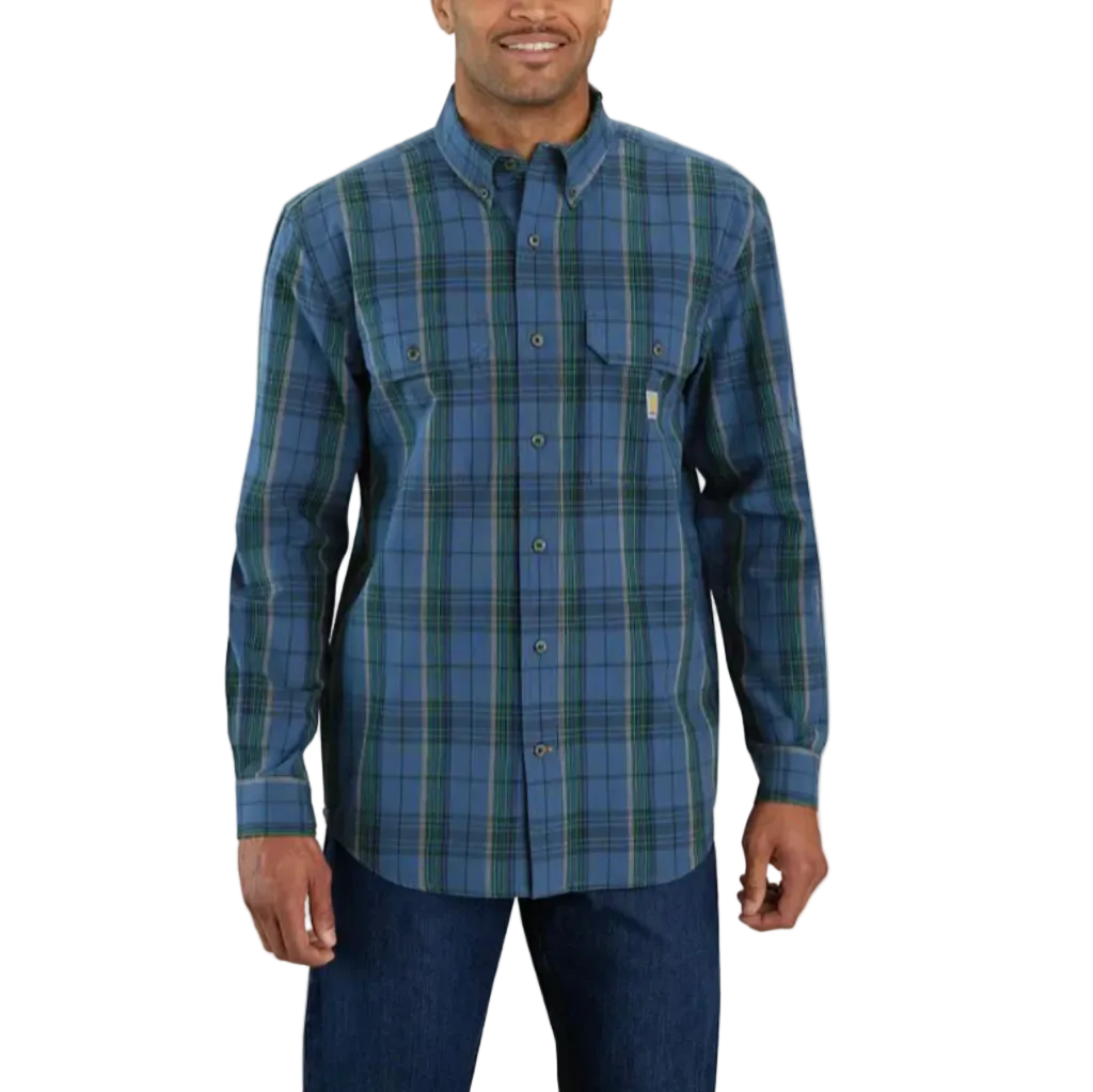 A man wearing a blue and green plaid long-sleeve button-down shirt with dark blue jeans, shown against a plain white background.
