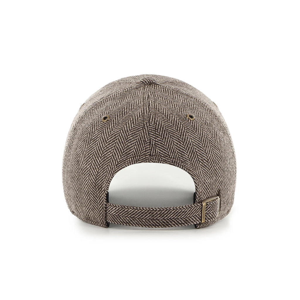 Brown herringbone patterned cap on a white background